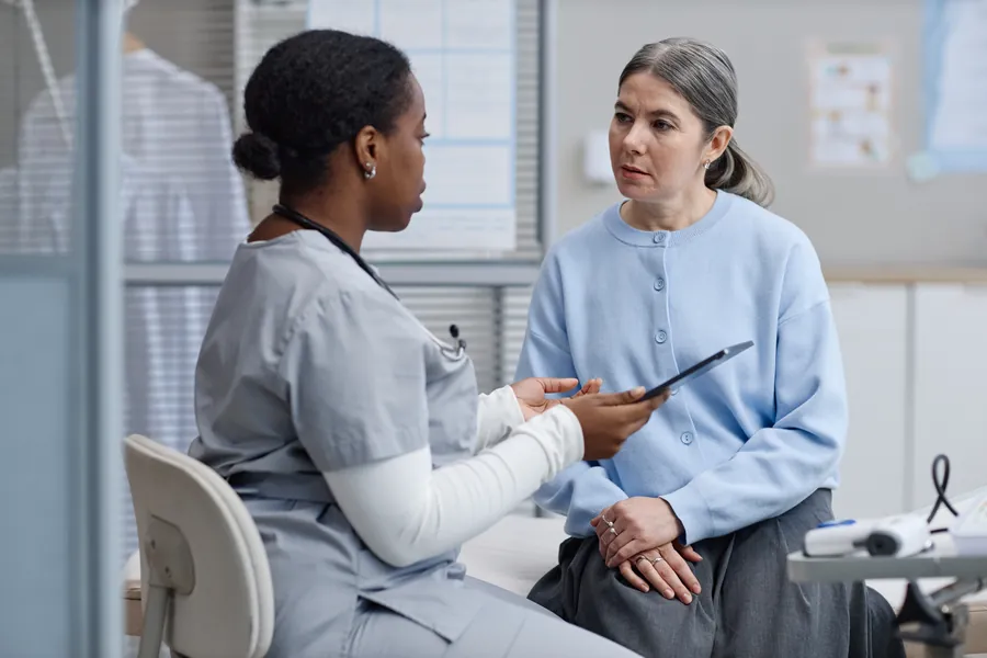 Doctor talking to patient with cardiovascular health issue
